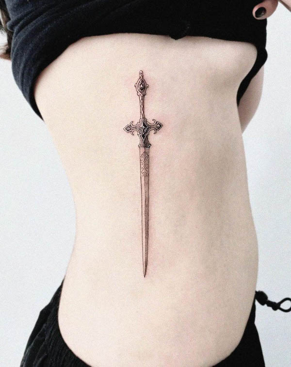 Dainty dagger side tattoo by @98_kamichi