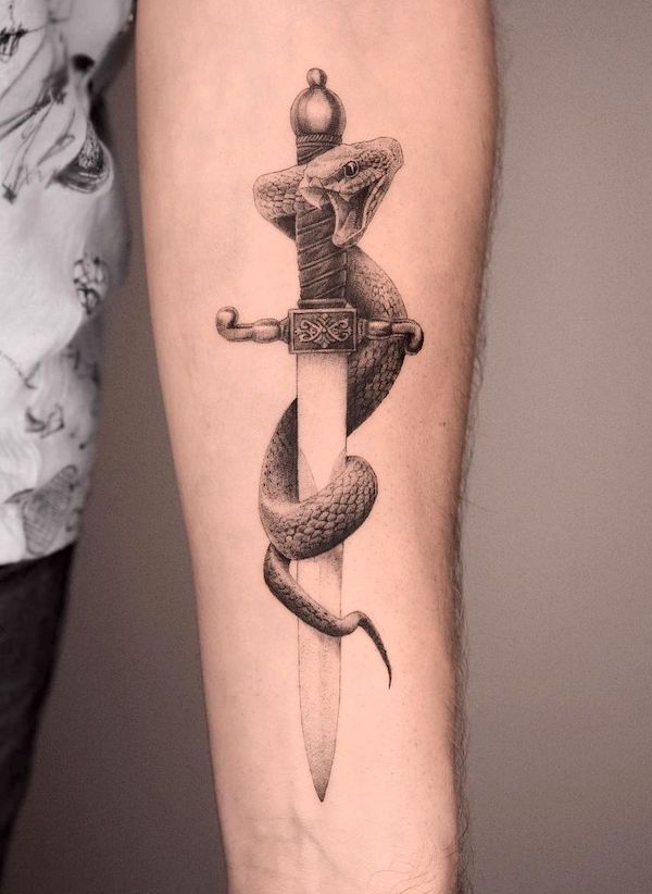 Hyper realistic snake dagger tattoo by @zawadzki_tattoo