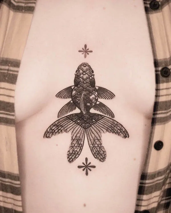 Intricate fish chest tattoo by @e.o.orient