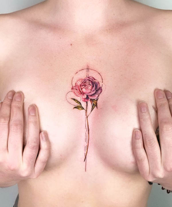 Intricate rose chest tattoo by @sara_qano