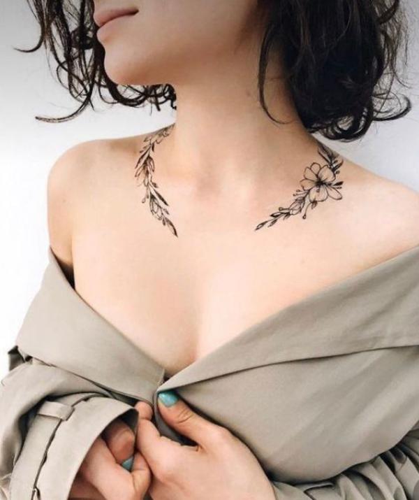 Leaves with flower necklace tattoo