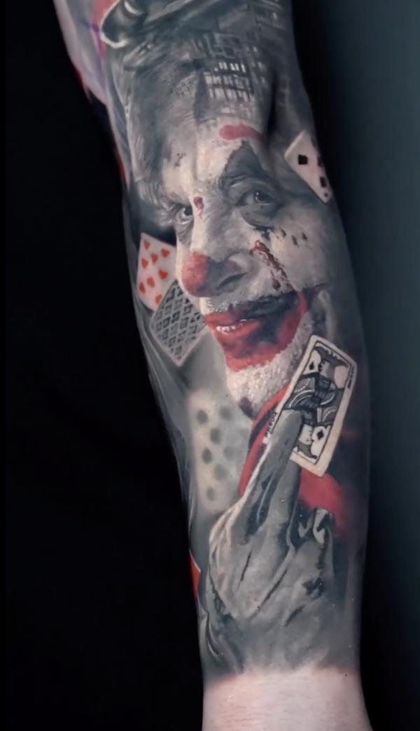 Realistic Joker and cards tattoo