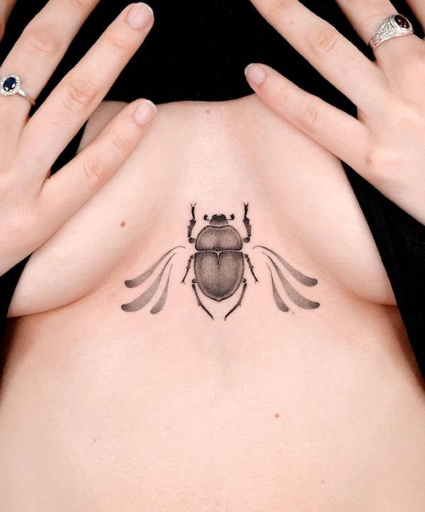 Beetle tattoo between boobs by @choiyun_tattoo