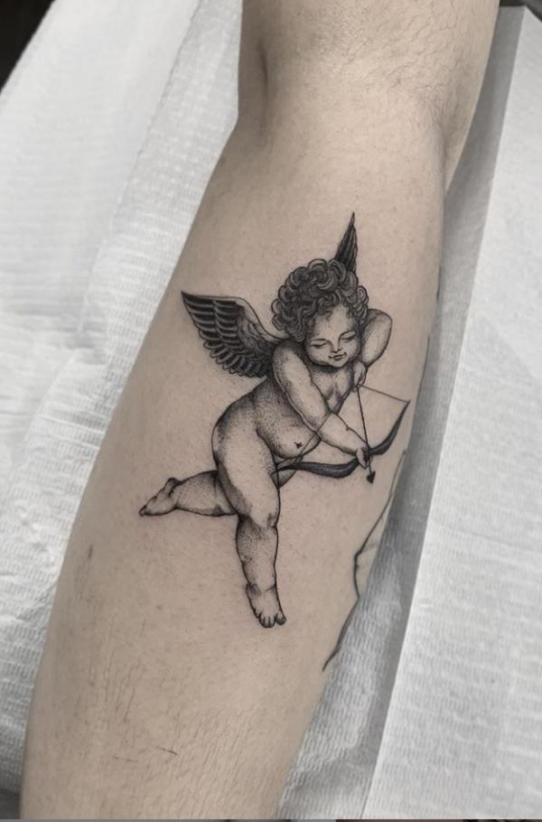 cupid arm tattoo