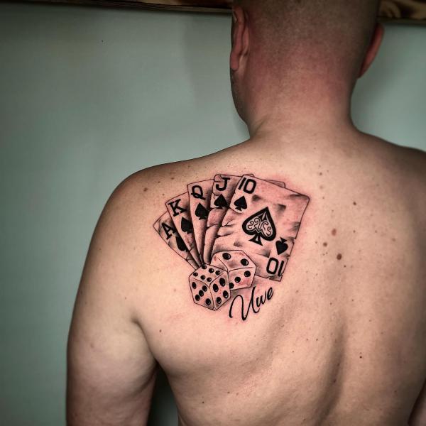 playing cards and dices shoulder blade tattoo