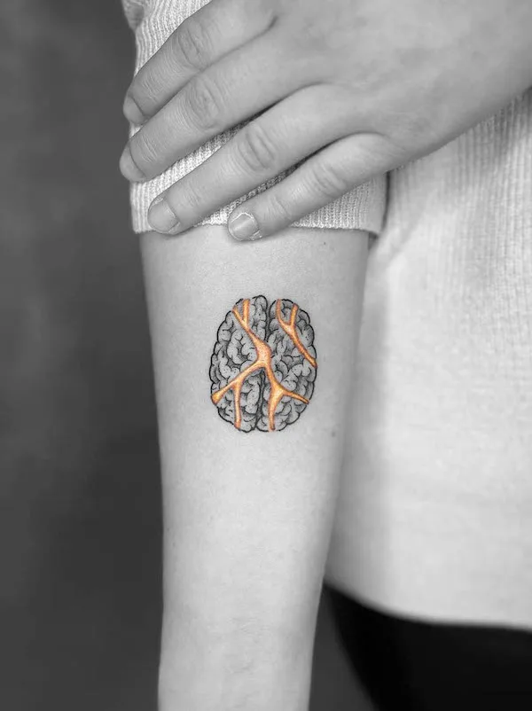 Golden cracks of brain tattoo by @ladyb.ink_