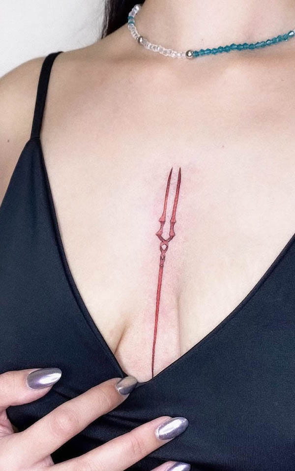 Holy Lance between the boobs tattoo by @sherstobitovvvv