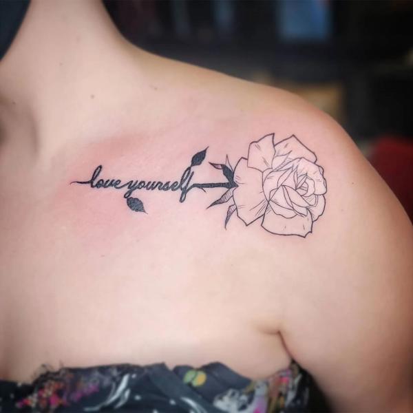 Rose outline with the words Love yourself on clavicle