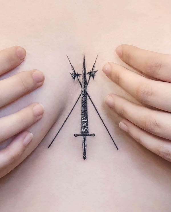 The Three of Sword tattoo between boob by @stuffie.ink_