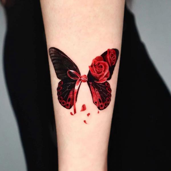 Black and red butterfly with rose tattoo