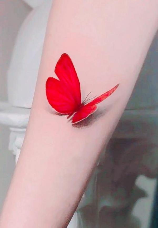 Single red butterfly tattoo