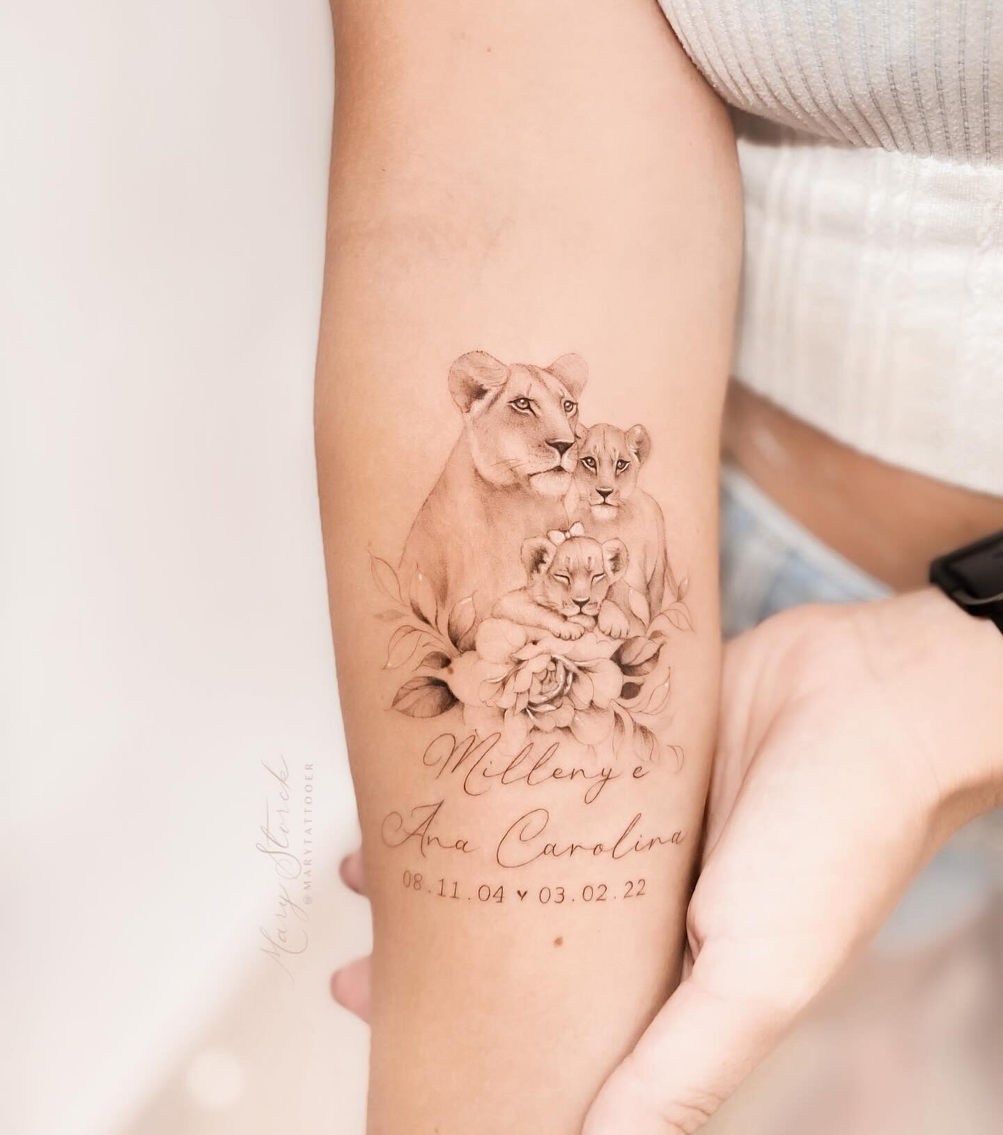 Lion family portrait tattoo on the forearm