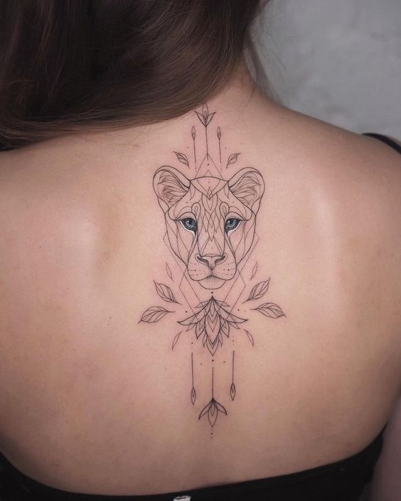 Ornamental lioness tattoo on the upper back