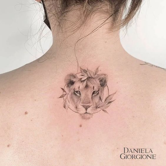 Lioness tattoo on the upper back