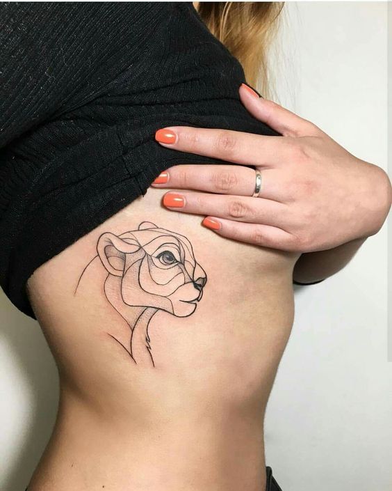 Fine line style lioness tattoo on the ribs