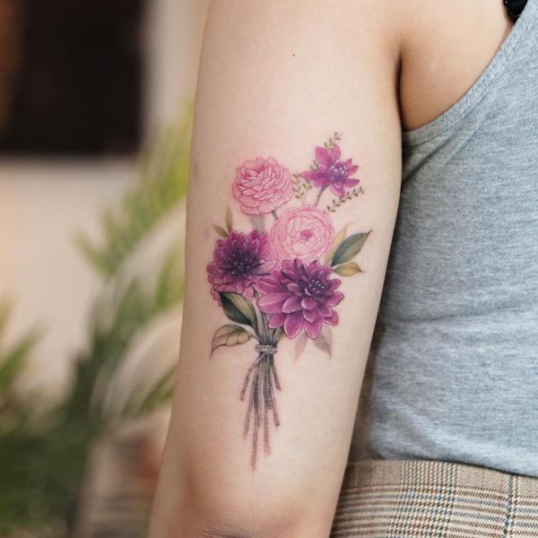 A bouquet of flowers with dahlia rose tattoo