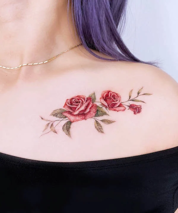 Elegant red roses on the side chest tattoo by @miiu_tattoo