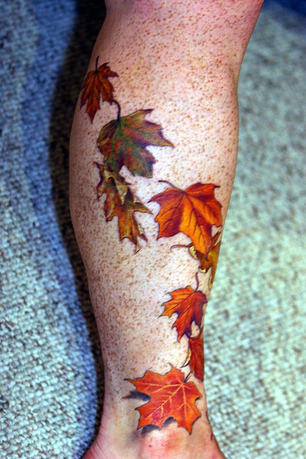 Orange foliage lower leg tattoo