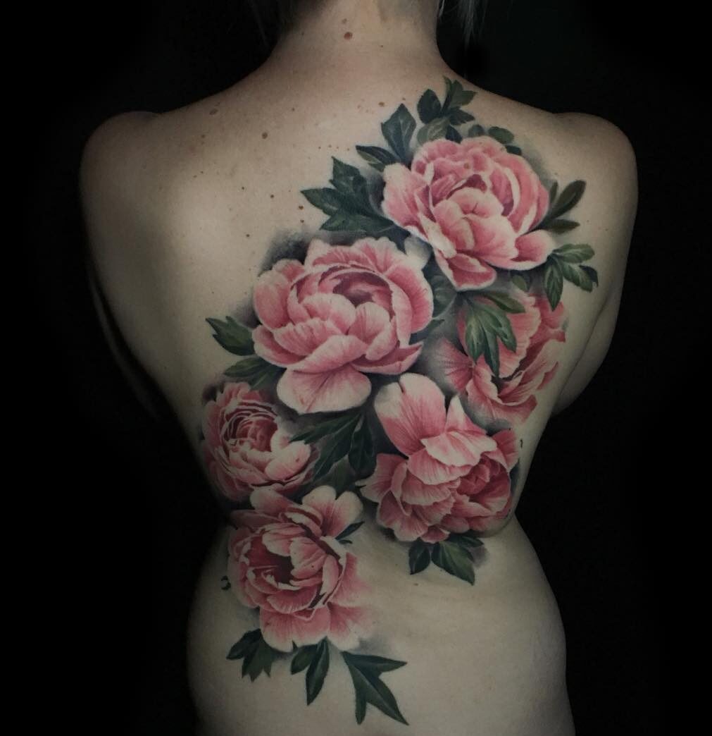 Realistic pink peonies tattooed on the back